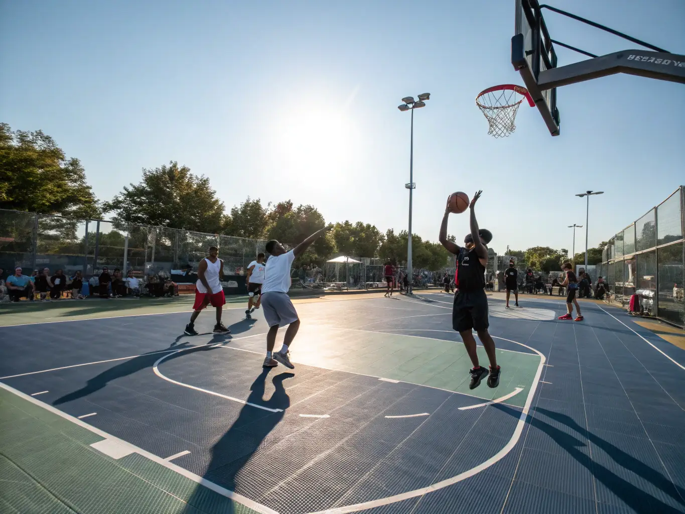 An action shot of adults playing basketball in a well-lit indoor court, demonstrating the competitive spirit and camaraderie of the adult basketball league at CLUB SPORTIF ARGENTAIS.